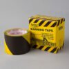 Norobežojošā lente 70 mmx100 m,melni-dzeltena